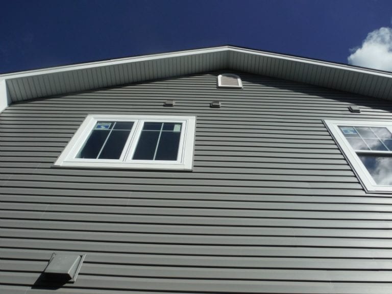 Home with new charcoal gray vinyl siding
