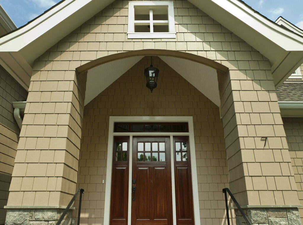Shigle shake siding on the front entryway of a home.