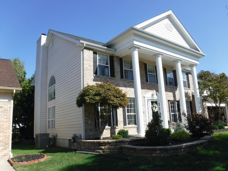 home with new siding and columns