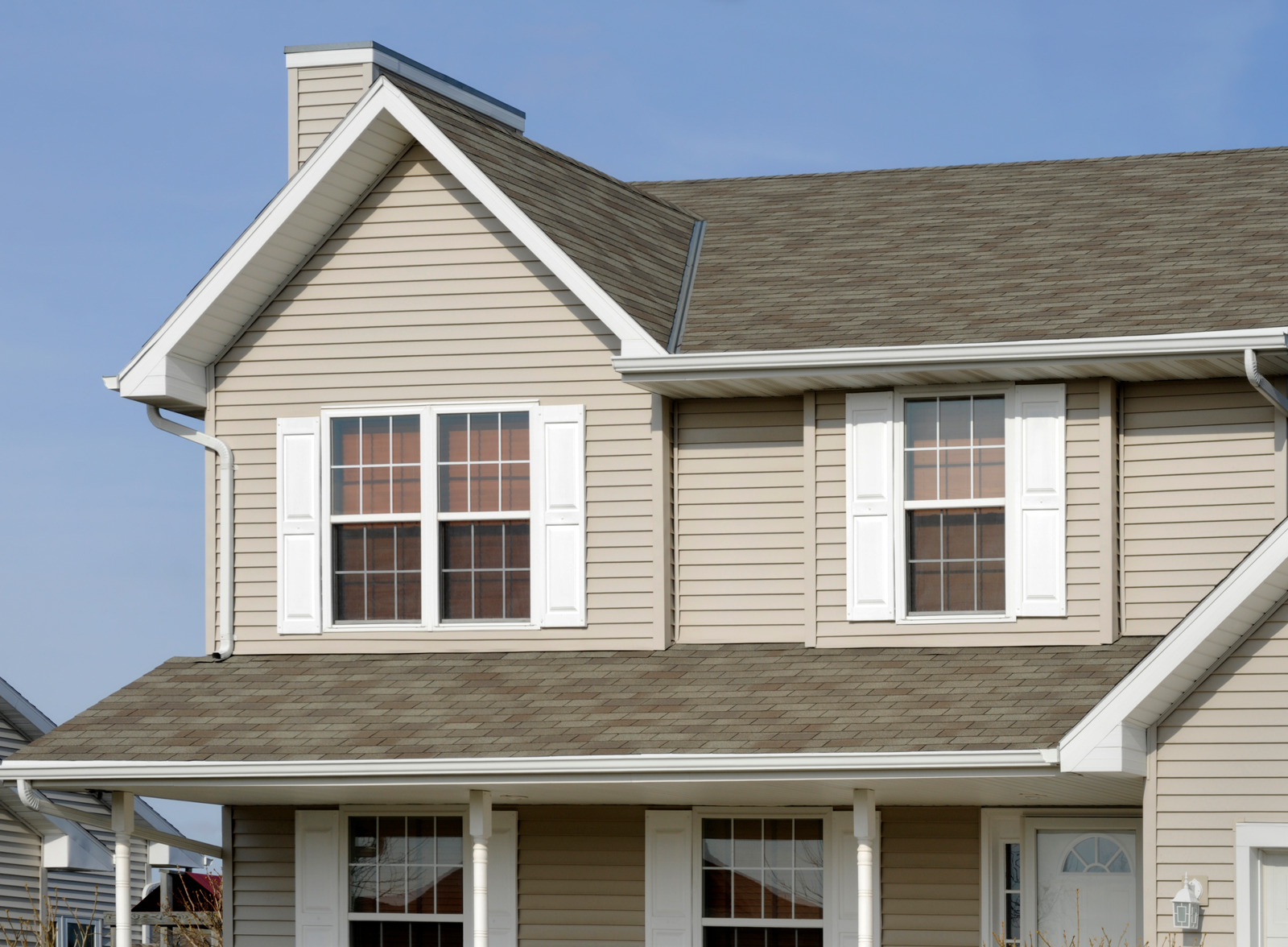 Two-story home with fresh siding. How long does it take to replace siding on a two-story home?